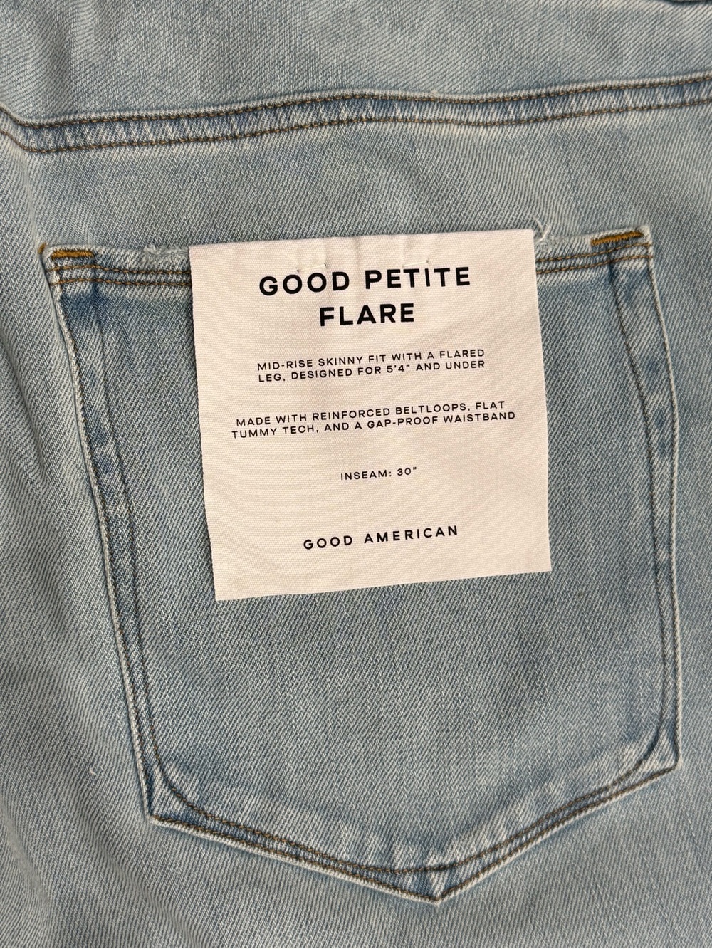 Good American Petite Flare Jeans in Light Wash Blue